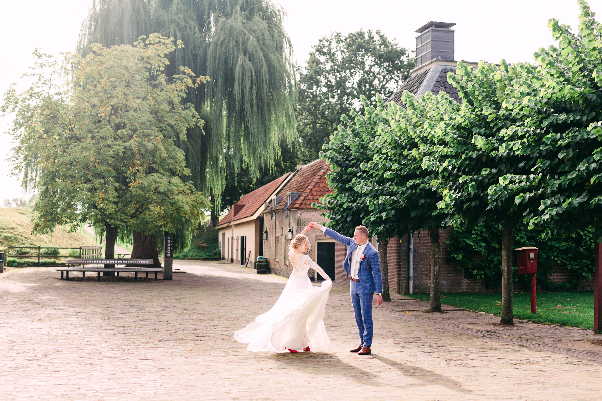 bride and groom dancing in castle courtyard